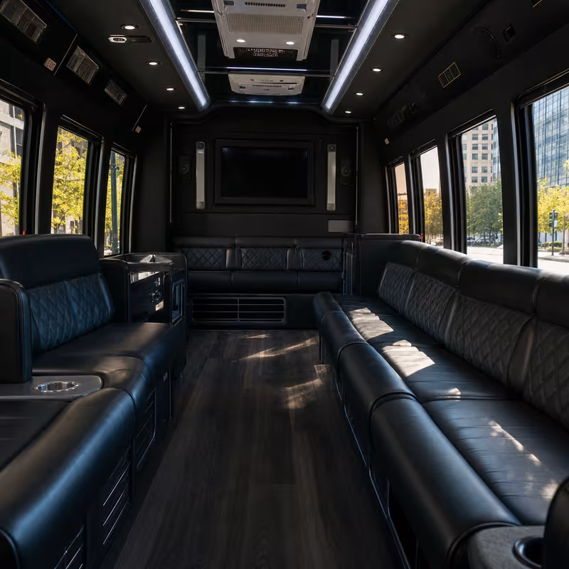 Friends laughing during a Sterling Heights party bus celebration