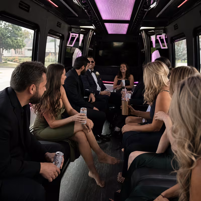 Wedding guests seated inside a Sterling Heights party bus