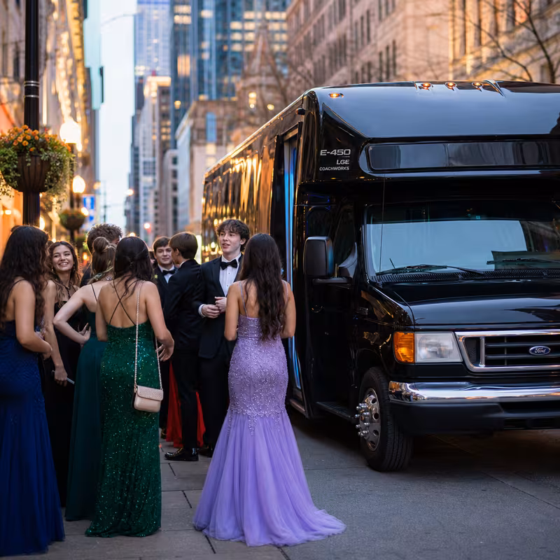 Passengers loading luggage while boarding an Sterling Heights group shuttle