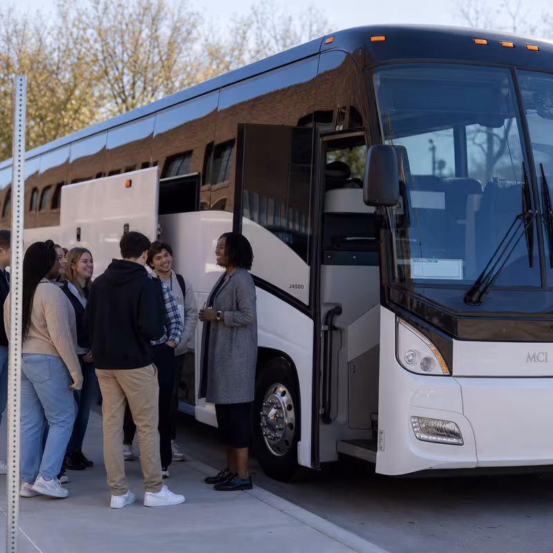 Black Mercedes Sprinter van staged for an Sterling Heights School Transportation group