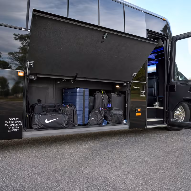 Party bus interior with wraparound leather seating and LED lighting in Sterling Heights