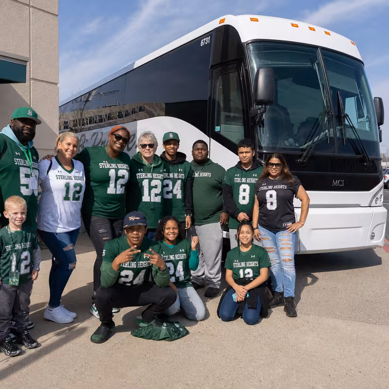 Passengers loading luggage while boarding an Sterling Heights group shuttle