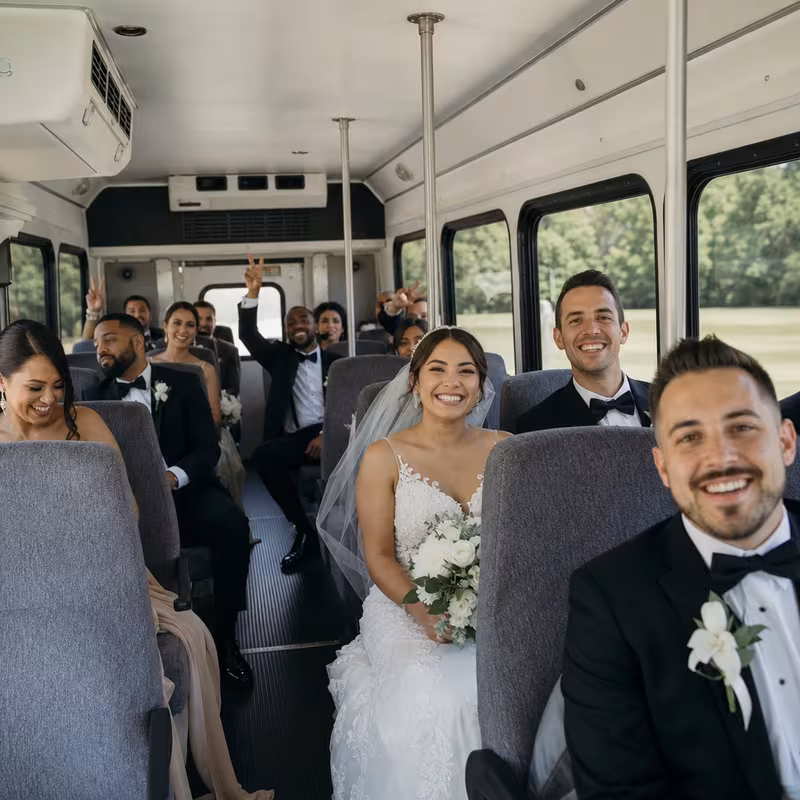 Group boarding a white charter bus for Wedding Transportation transportation in Sterling Heights