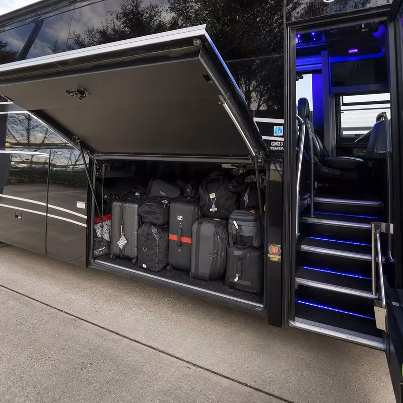 Party bus interior with wraparound leather seating and LED lighting in Sterling Heights