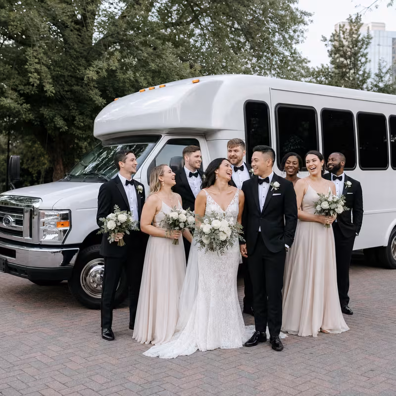 Passengers loading luggage while boarding an Sterling Heights group shuttle